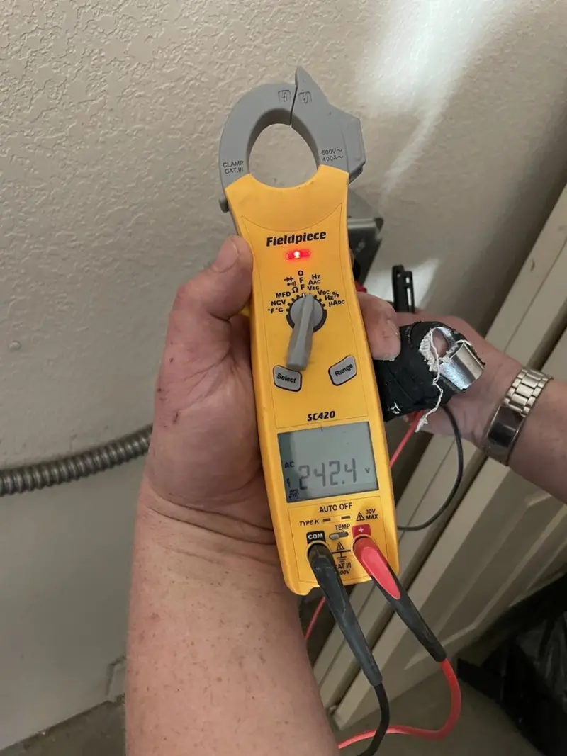 Voltage testing with clamp meter during Ceiling Fan Installation in Lumberton